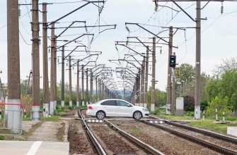 car moving empty railway level crossing