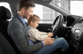 cute father with son sitting seat driver new car