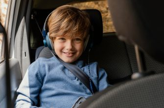 portrait boy car with headphones listening music 1